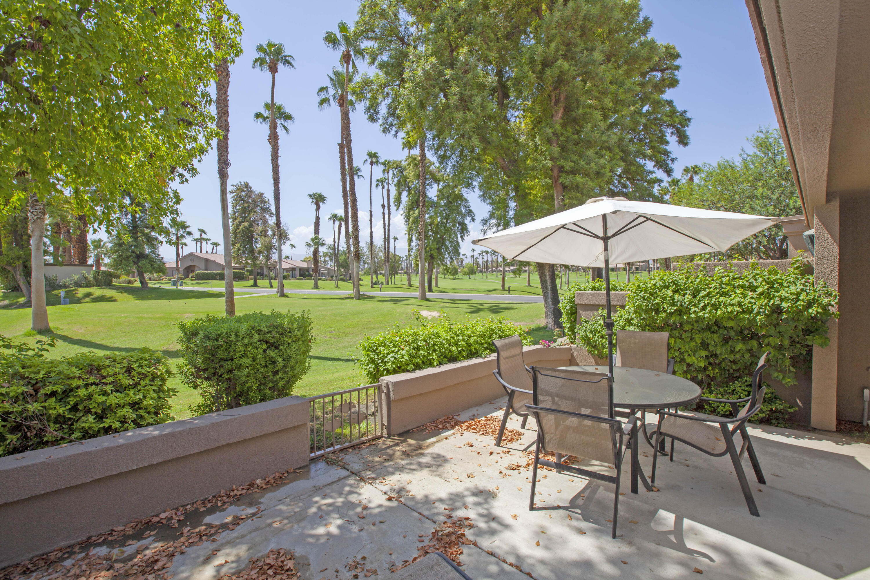 76131 Impatiens Circle Palm Desert, CA 92211 - Photo 2 of 27 a garden view with a seating space