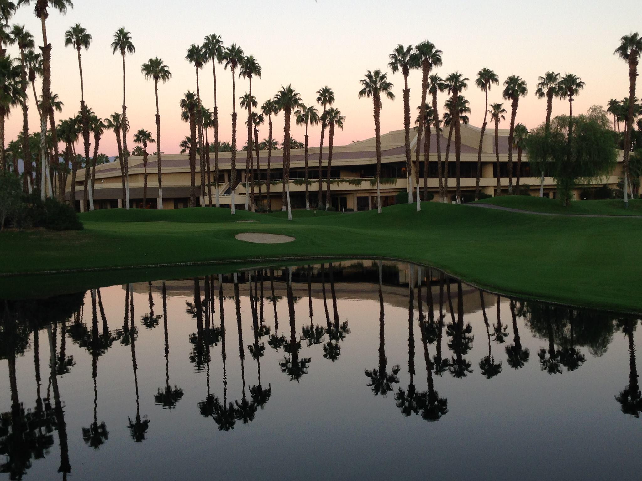 76131 Impatiens Circle Palm Desert, CA 92211 - Photo 25 of 27 a view of a swimming pool and trees in the background
