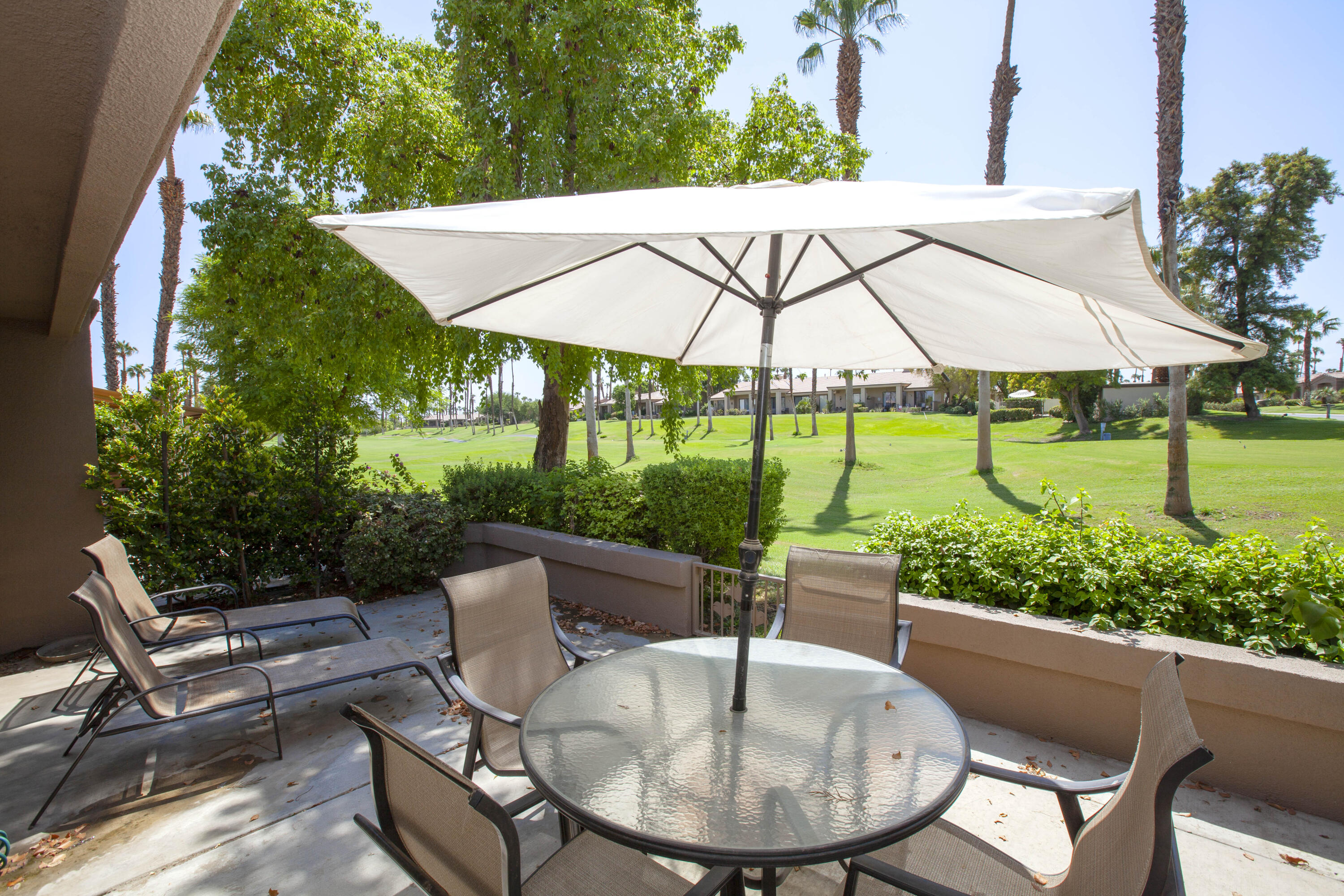 76131 Impatiens Circle Palm Desert, CA 92211 - Photo 3 of 27 a view of an outdoor sitting area with furniture and backyard