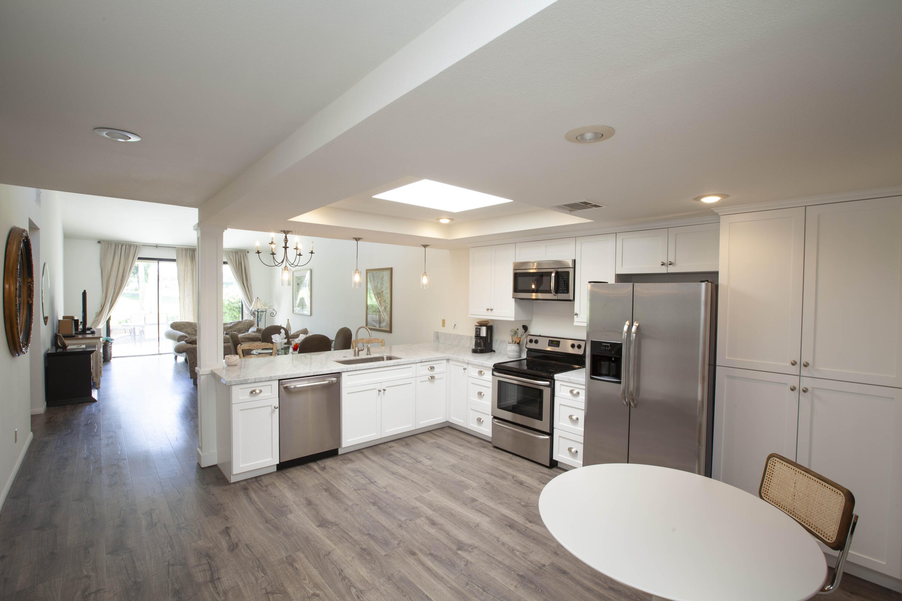 76131 Impatiens Circle Palm Desert, CA 92211 - Photo 6 of 27 a kitchen with refrigerator and stove