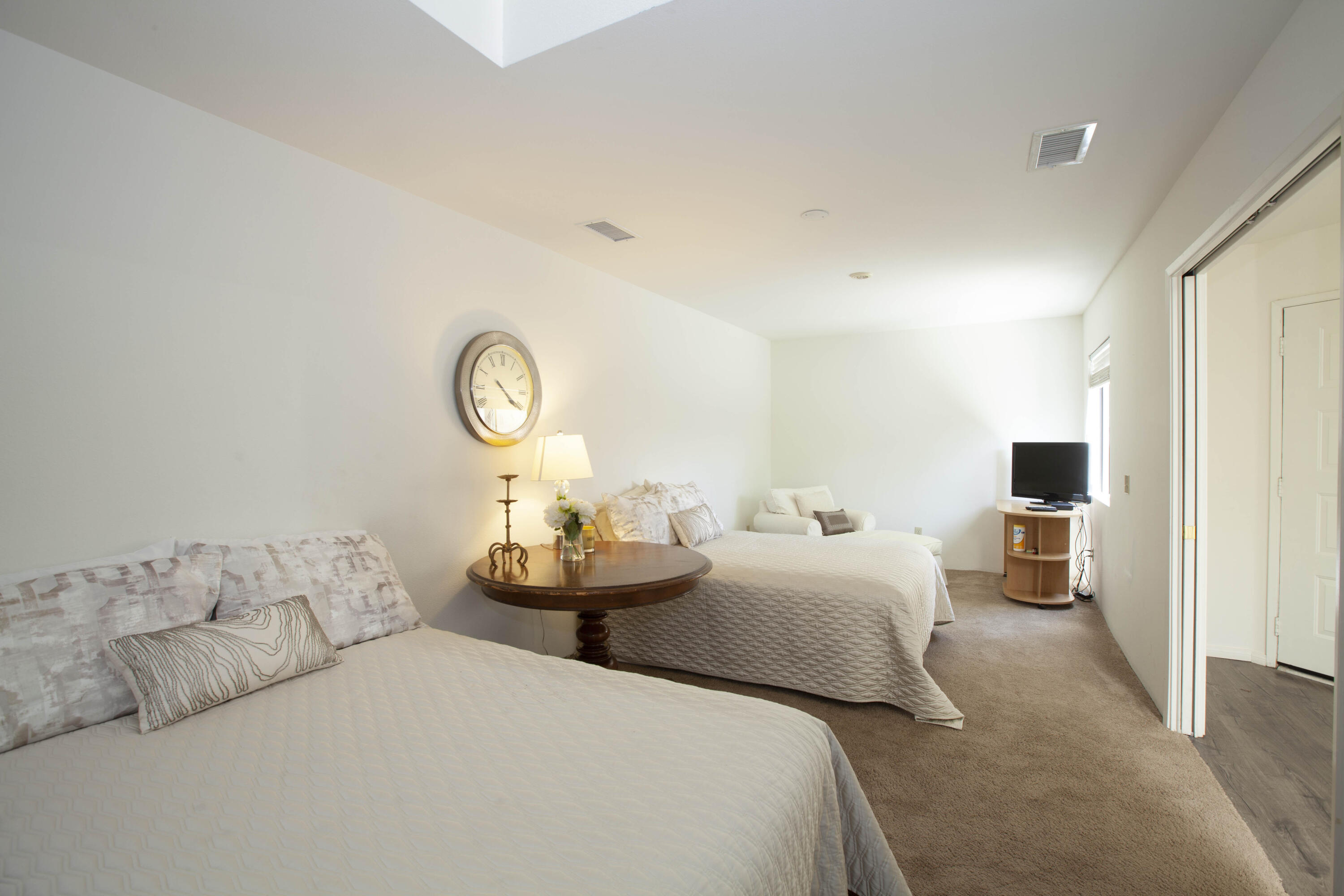 76131 Impatiens Circle Palm Desert, CA 92211 - Photo 9 of 27 a bedroom with bed and a large mirror