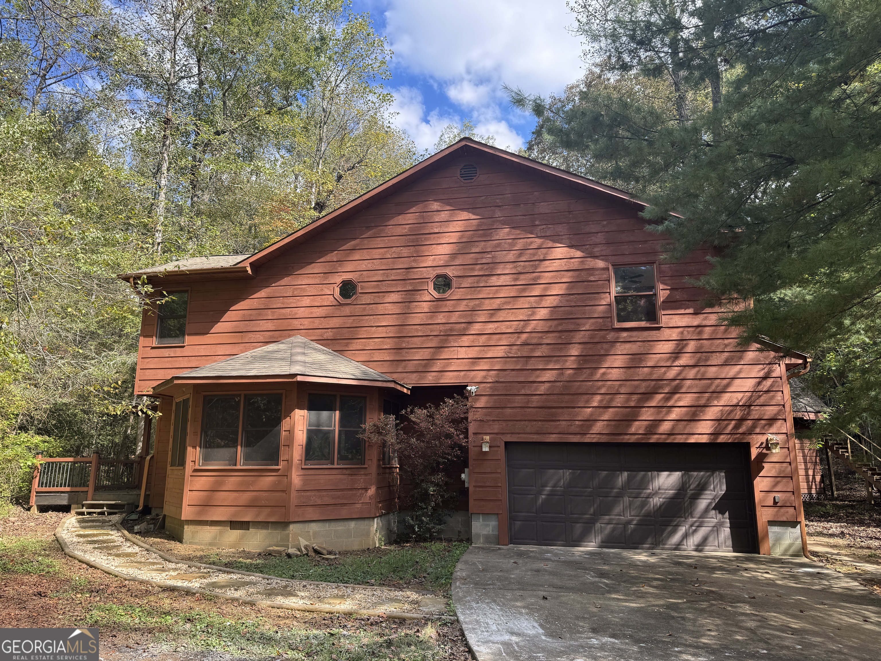 a front view of a house with garden