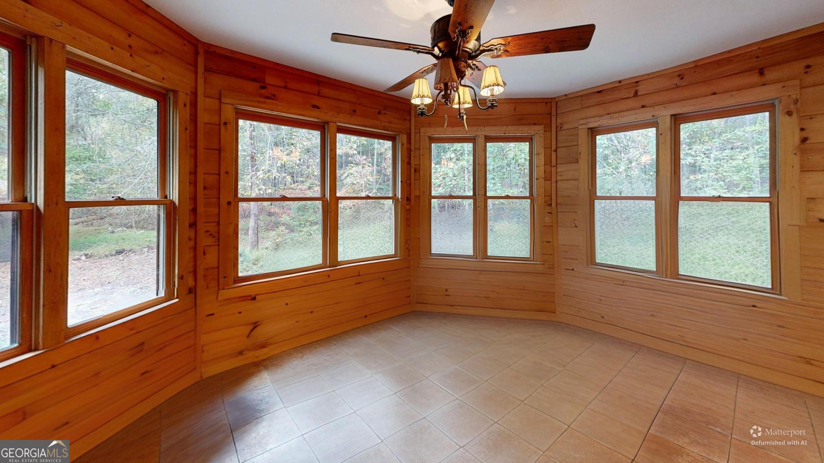 330 Pine Grove Drive Blue Ridge, GA 30513 - Photo 25 of 33 a view of an empty room with a window and wooden floor