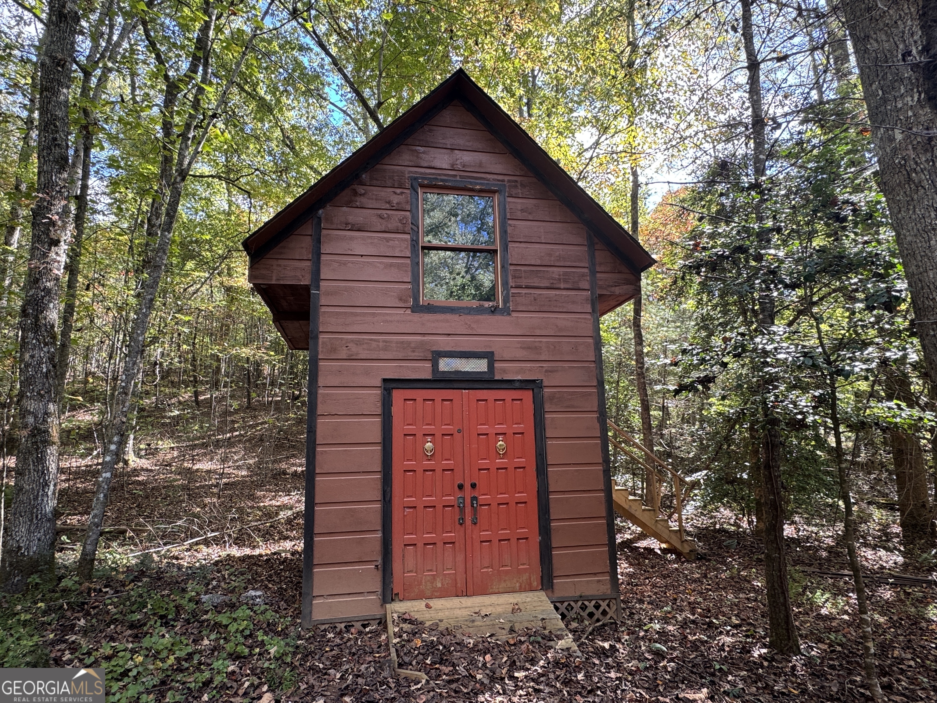 330 Pine Grove Drive Blue Ridge, GA 30513 - Photo 9 of 33 a view of a small house with large tree