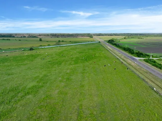 a view of field with ocean view