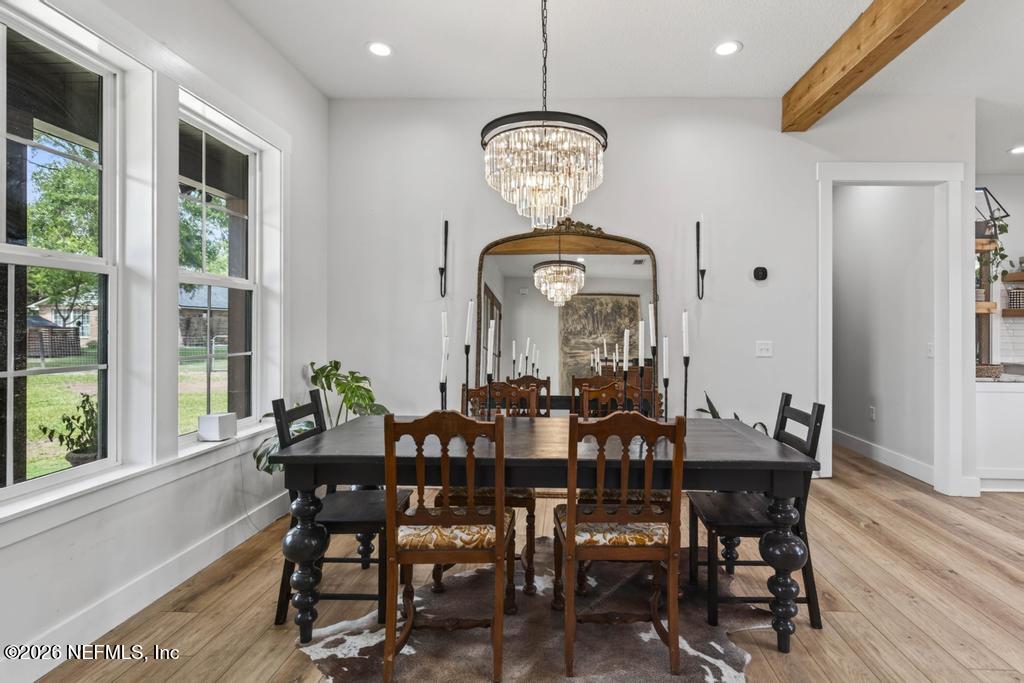 2955 Carroll Corner Road Hilliard, FL 32046 - Photo 28 of 106 a view of a dining room with furniture window and wooden floor