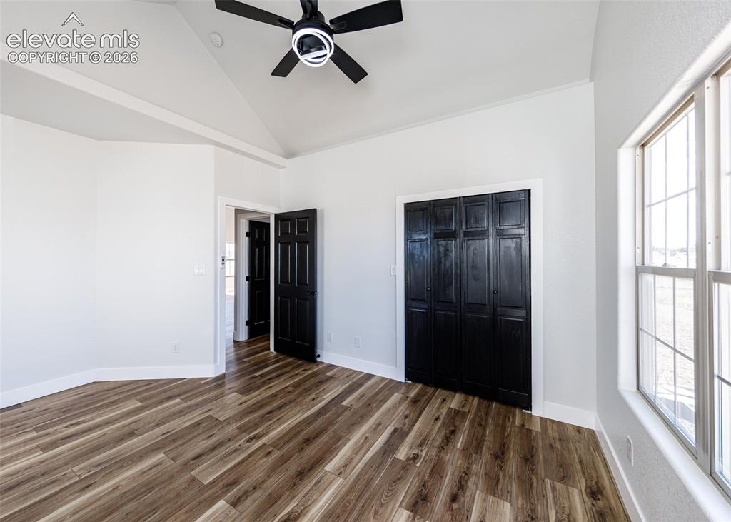 1120 Newton Road Pueblo, CO 81005 - Photo 19 of 46 a view of a room with wooden floor and windows