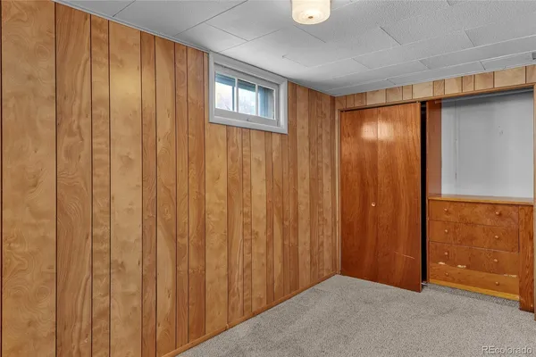 a view of entryway with wooden walls
