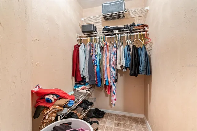 a view of a swimming pool with a yard and sitting area