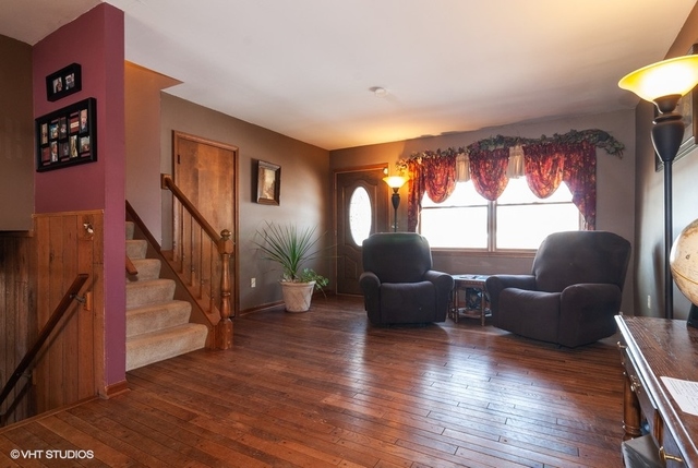 2S337 Dauberman Road Elburn, IL 60119 - Photo 2 of 20 a living room with furniture and a wooden floor