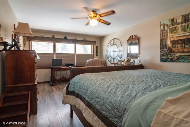 2S337 Dauberman Road Elburn, IL 60119 - Photo 11 of 20 a bedroom with a bed and wooden floor