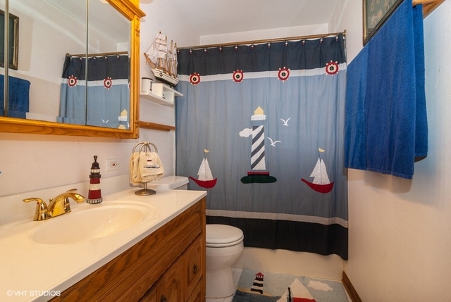 2S337 Dauberman Road Elburn, IL 60119 - Photo 16 of 20 a bathroom with a sink a toilet and shower