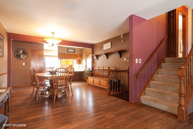 2S337 Dauberman Road Elburn, IL 60119 - Photo 3 of 20 a view of a dining room with furniture window and wooden floor