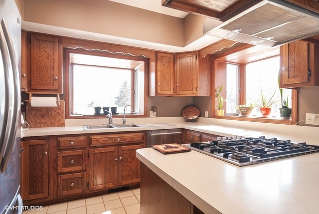 2S337 Dauberman Road Elburn, IL 60119 - Photo 5 of 20 a kitchen with a stove a sink and a window
