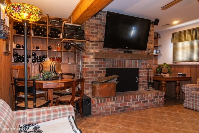 2S337 Dauberman Road Elburn, IL 60119 - Photo 8 of 20 a living room with fireplace and a flat screen tv