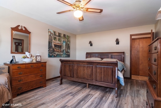 2S337 Dauberman Road Elburn, IL 60119 - Photo 10 of 20 a bedroom with a bed and wooden floor