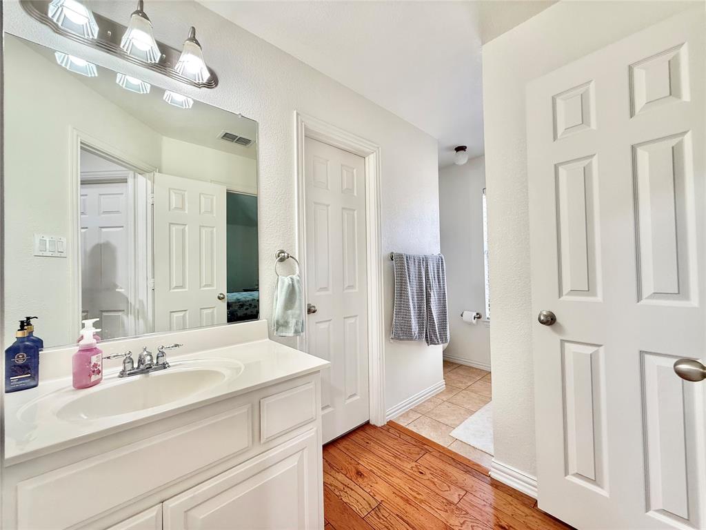 2754 Ridge View Road Frisco, TX 75034 - Photo 21 of 34 a spacious bathroom with a double vanity sink mirror and shower
