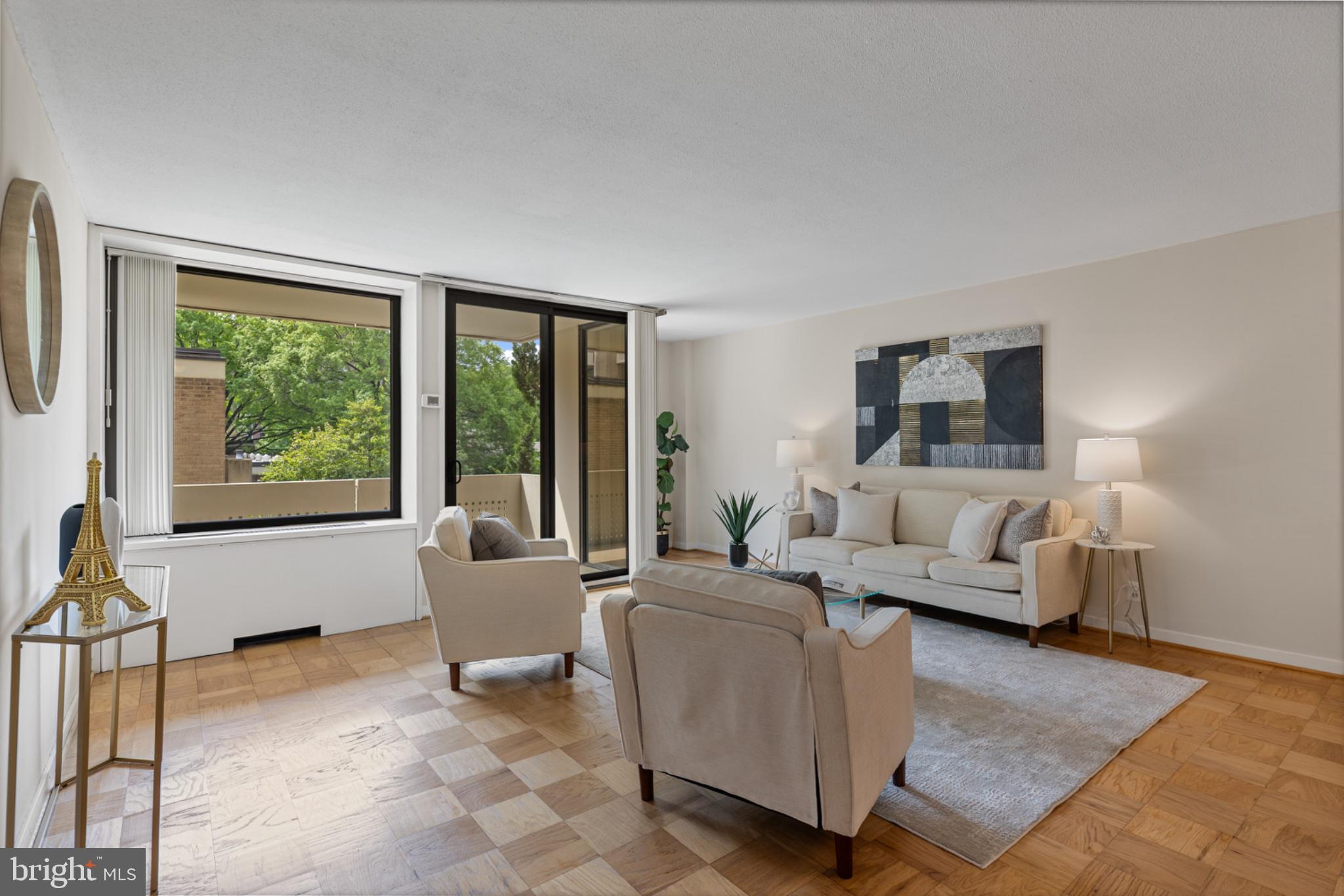 490 M Street Southwest, Unit W101 Washington, DC 20024 - Photo 2 of 26 a living room with furniture and large windows
