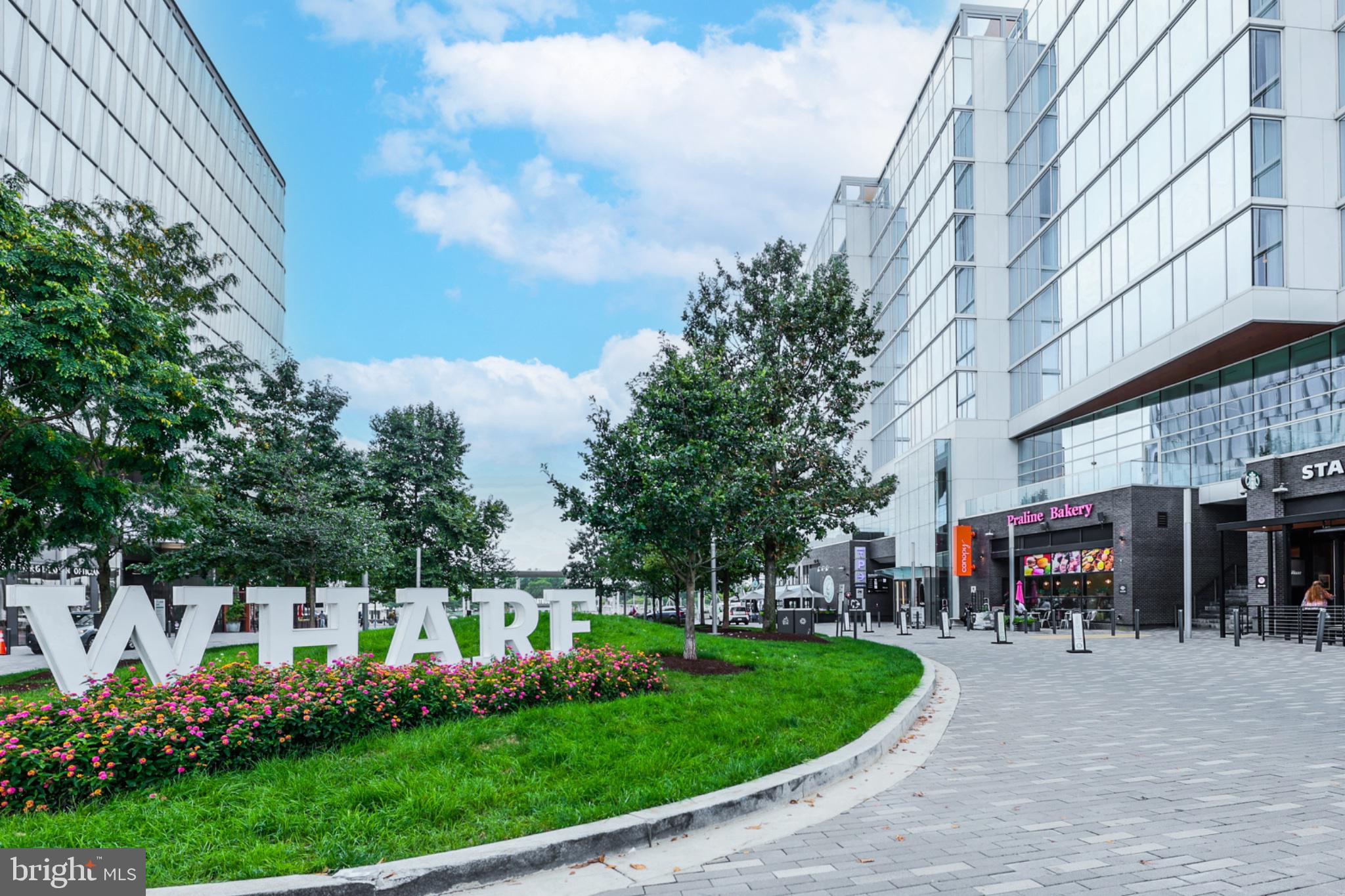 490 M Street Southwest, Unit W101 Washington, DC 20024 - Photo 25 of 26 a front view of a building with trees