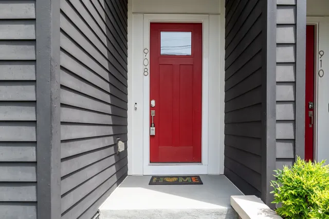 a view of a house with a door and wooden door