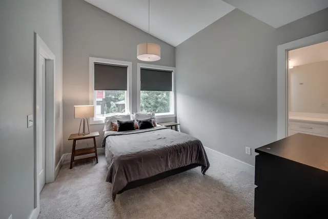 a bathroom with double vanity sinks and a mirror