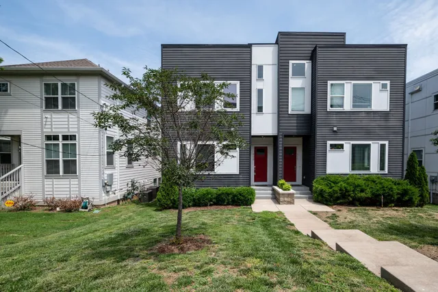 a view of a building with a parking area