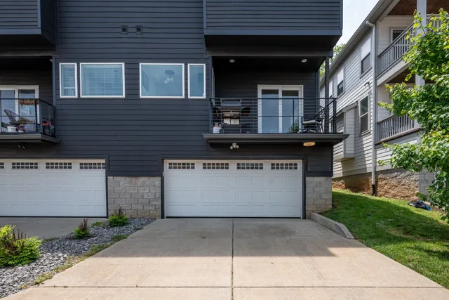 a view of house with a deck and furniture