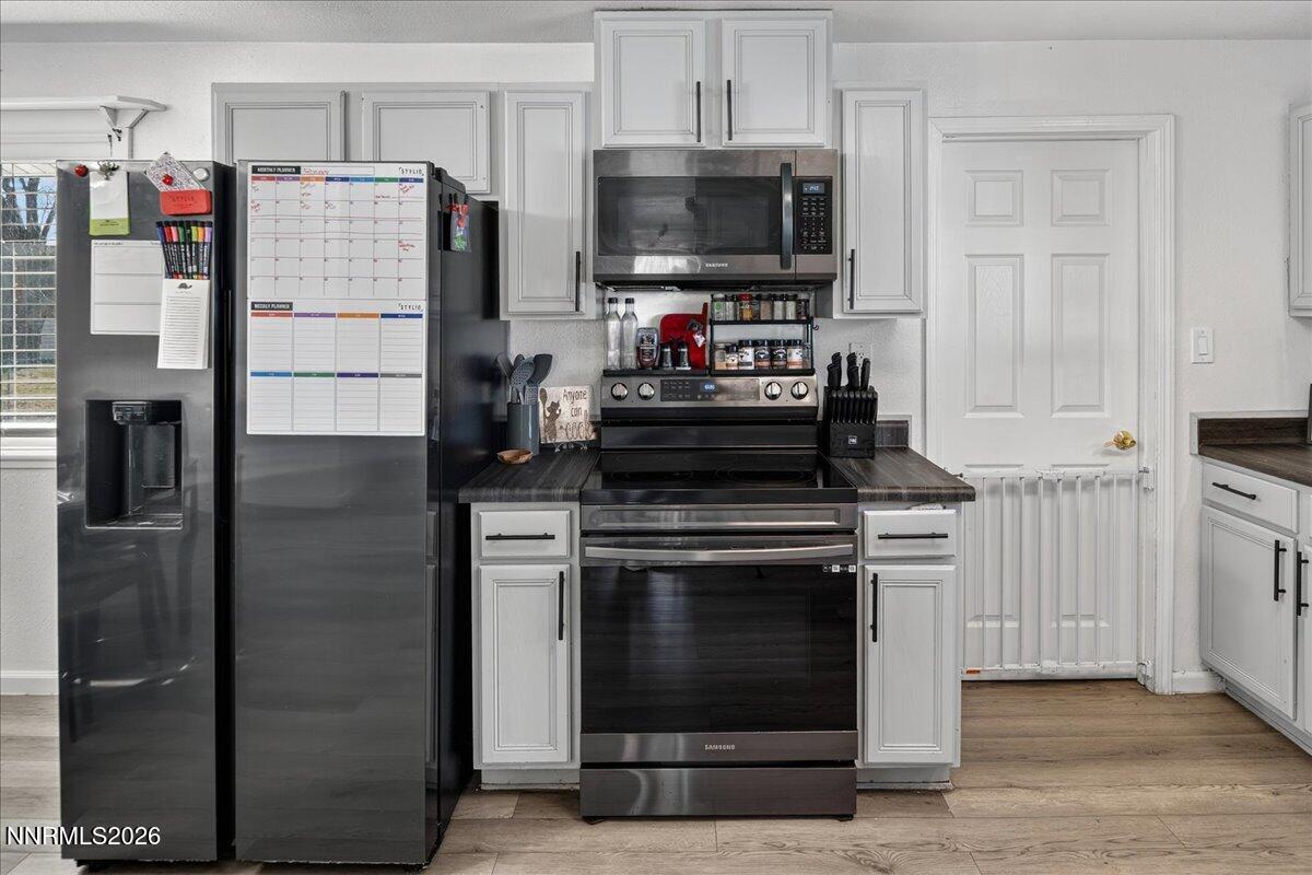 1777 Howard Court Sparks, NV 89434 - Photo 10 of 32 a kitchen with cabinets and stainless steel appliances