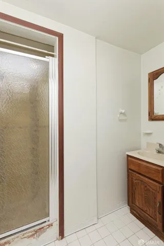 a bathroom with a shower and a sink
