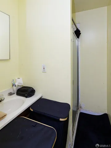 a room with a sink and a mirror