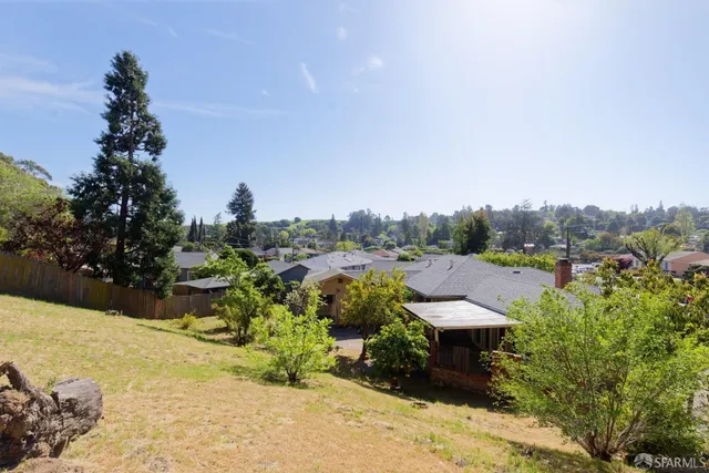a view of a garden with sitting area