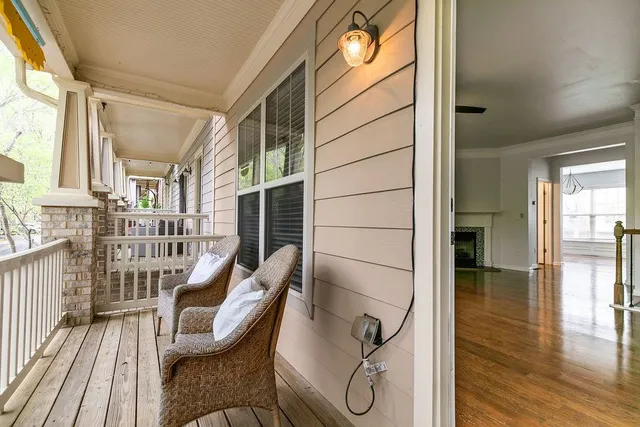 a view of a door and wooden floor