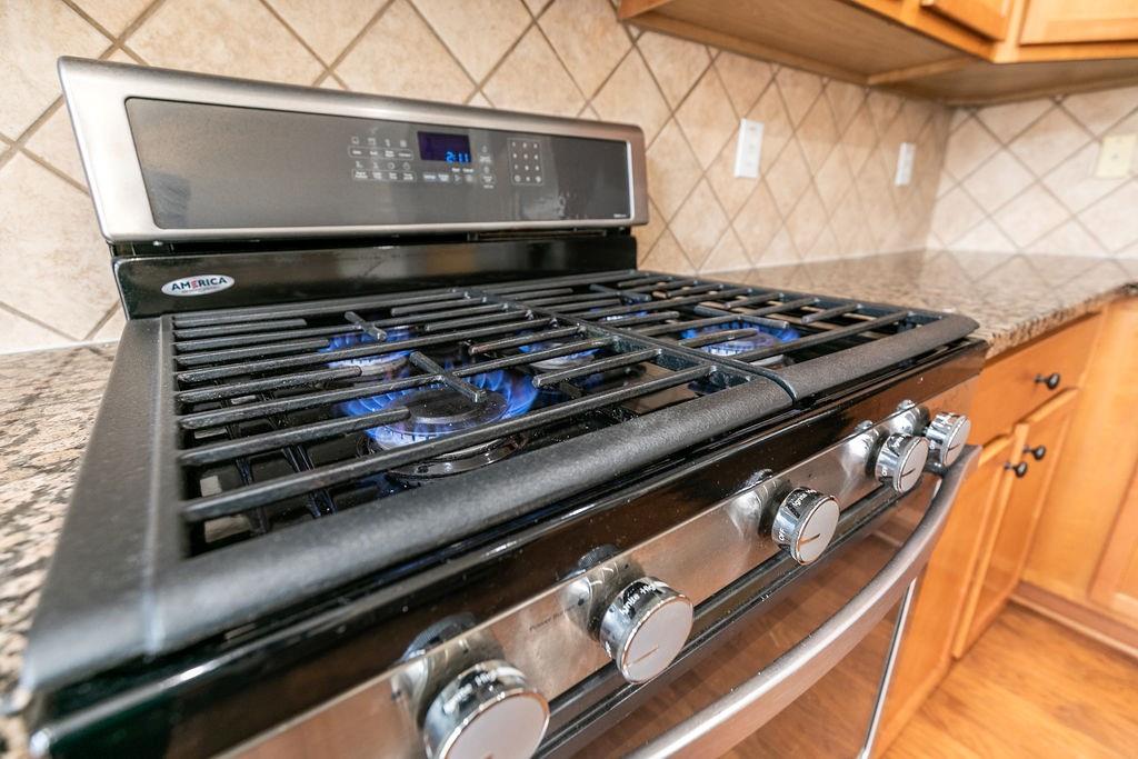827 Charles Bank Avenue Southeast, Unit 827 Atlanta, GA 30312 - Photo 16 of 45 a stove top oven sitting inside of a kitchen