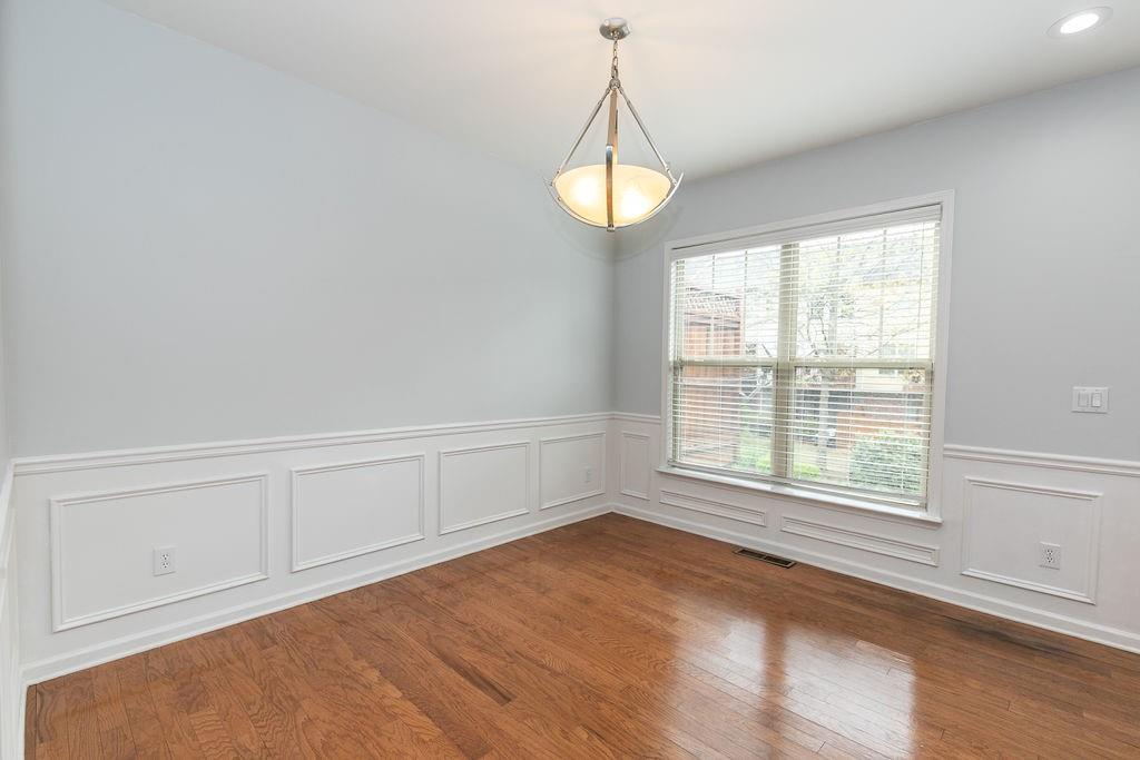 827 Charles Bank Avenue Southeast, Unit 827 Atlanta, GA 30312 - Photo 18 of 45 a view of an empty room with a window and wooden floor