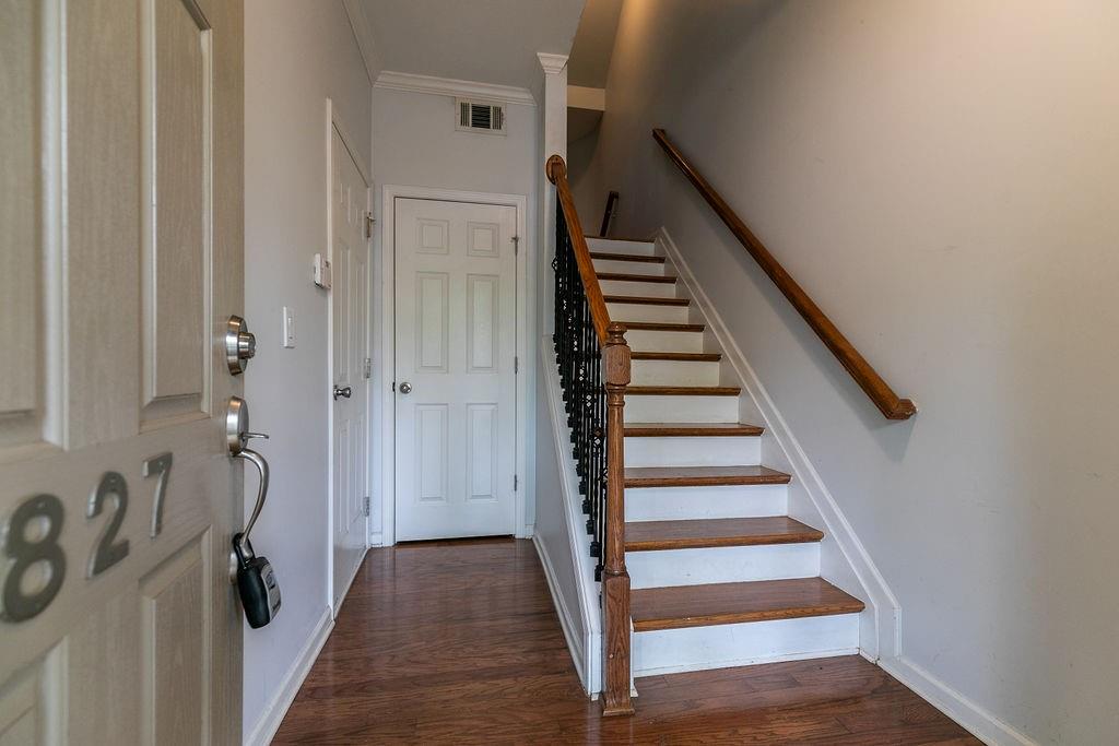 827 Charles Bank Avenue Southeast, Unit 827 Atlanta, GA 30312 - Photo 2 of 45 a view of a hallway with wooden floor and staircase