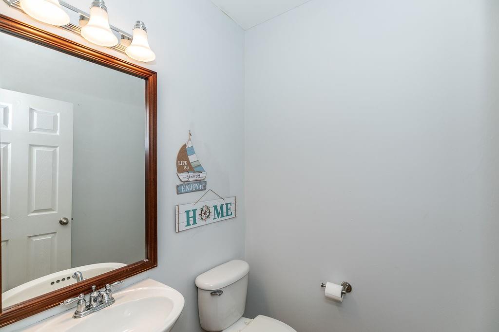 827 Charles Bank Avenue Southeast, Unit 827 Atlanta, GA 30312 - Photo 21 of 45 a white toilet sitting next to a bathroom sink