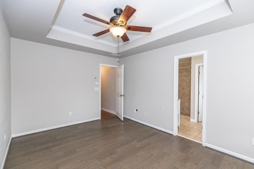827 Charles Bank Avenue Southeast, Unit 827 Atlanta, GA 30312 - Photo 26 of 45 an empty room with a window and a ceiling fan