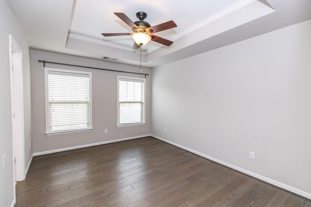 827 Charles Bank Avenue Southeast, Unit 827 Atlanta, GA 30312 - Photo 29 of 45 an empty room with wooden floor fan and windows