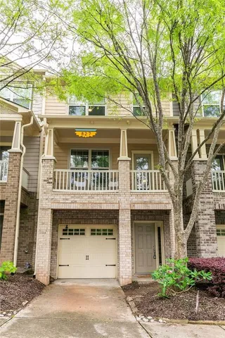 a front view of a house with a garage