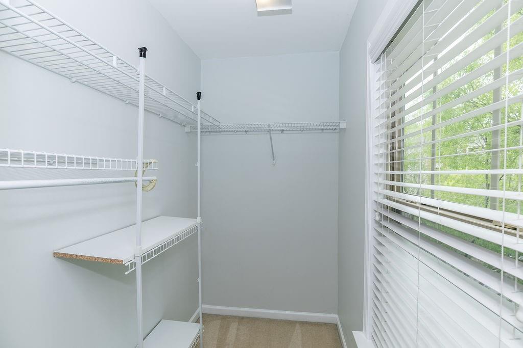 827 Charles Bank Avenue Southeast, Unit 827 Atlanta, GA 30312 - Photo 31 of 45 a bathroom with a shower curtain and a window