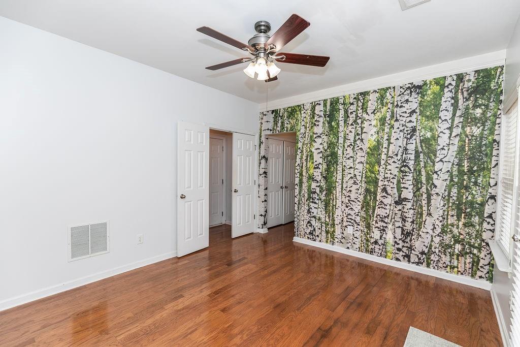 827 Charles Bank Avenue Southeast, Unit 827 Atlanta, GA 30312 - Photo 38 of 45 wooden floor in an empty room with a window