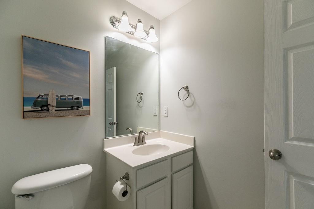 827 Charles Bank Avenue Southeast, Unit 827 Atlanta, GA 30312 - Photo 39 of 45 a bathroom with a toilet sink and mirror