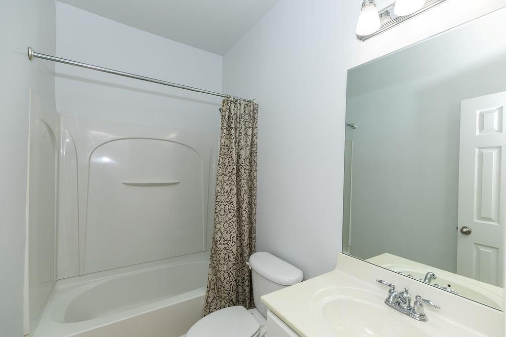 827 Charles Bank Avenue Southeast, Unit 827 Atlanta, GA 30312 - Photo 40 of 45 a bathroom with a sink toilet and shower