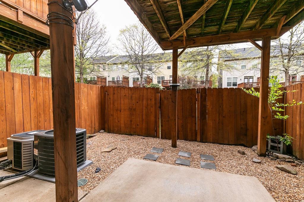827 Charles Bank Avenue Southeast, Unit 827 Atlanta, GA 30312 - Photo 41 of 45 a bedroom with a bed and a large window