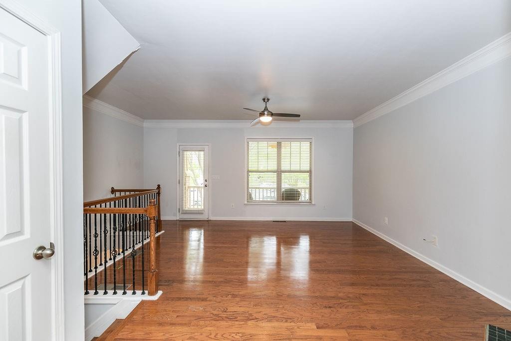 827 Charles Bank Avenue Southeast, Unit 827 Atlanta, GA 30312 - Photo 6 of 45 a view of an empty room with wooden floor and a window