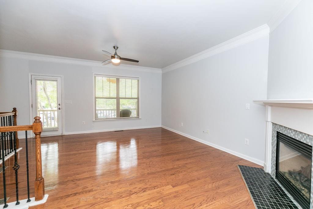 827 Charles Bank Avenue Southeast, Unit 827 Atlanta, GA 30312 - Photo 7 of 45 a view of empty room with wooden floor and fan
