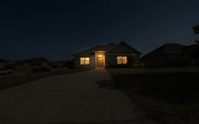 a back view of a house with backyard