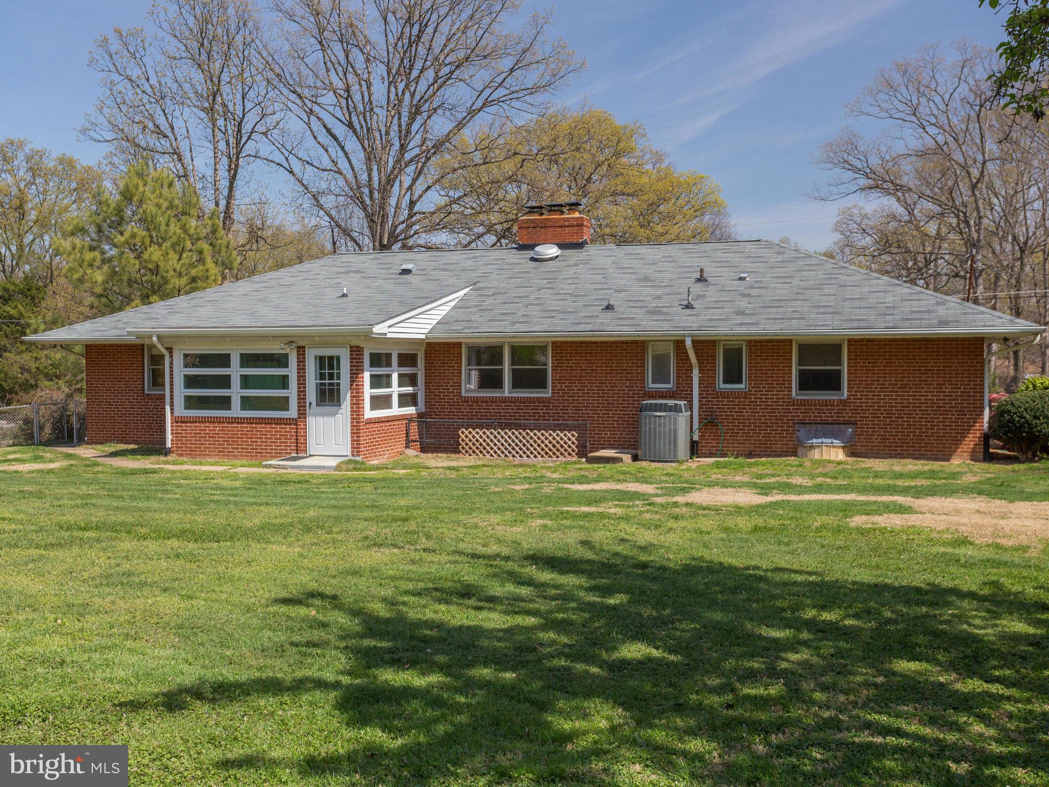 6714 Greenleaf Street Springfield, VA 22150 - Photo 14 of 30 a front view of a house with a garden