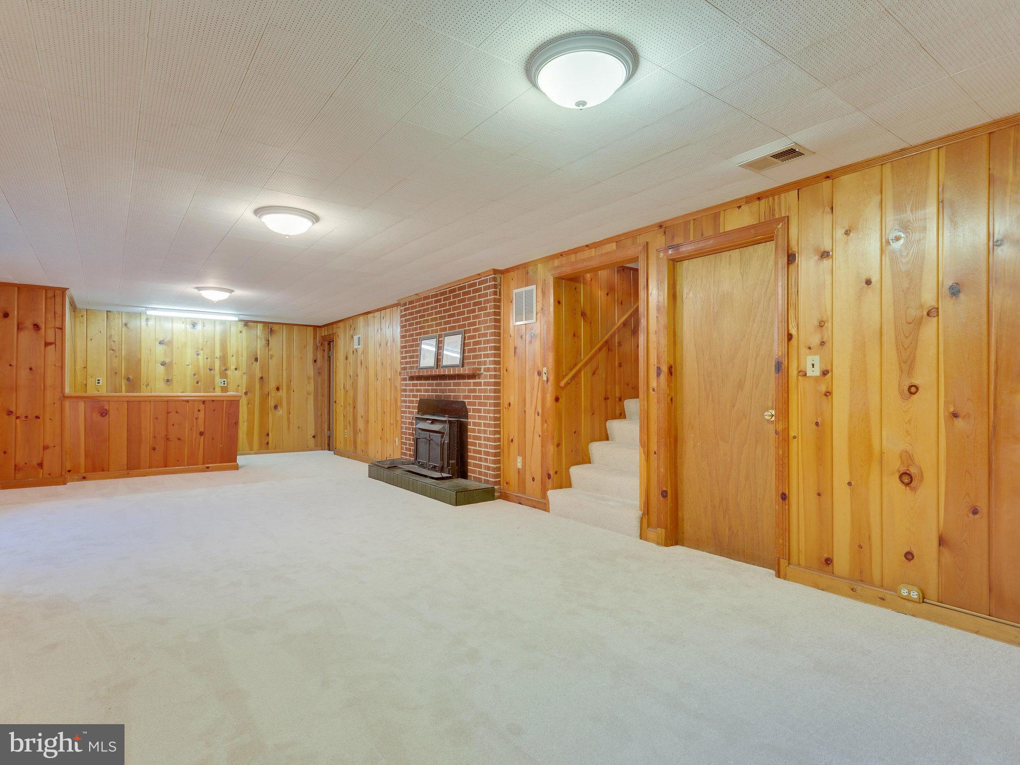 6714 Greenleaf Street Springfield, VA 22150 - Photo 20 of 30 a view of an empty room with a fireplace