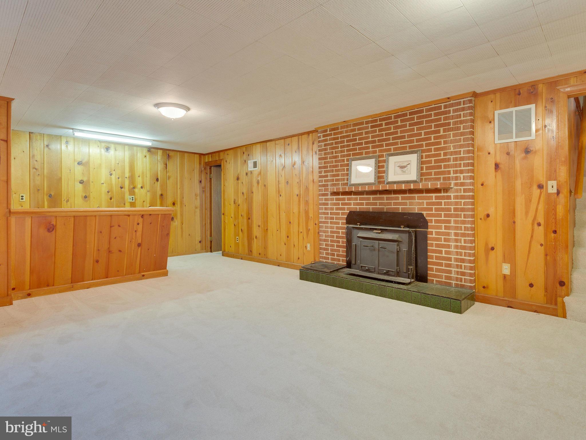 6714 Greenleaf Street Springfield, VA 22150 - Photo 21 of 30 a view of empty room with a fireplace